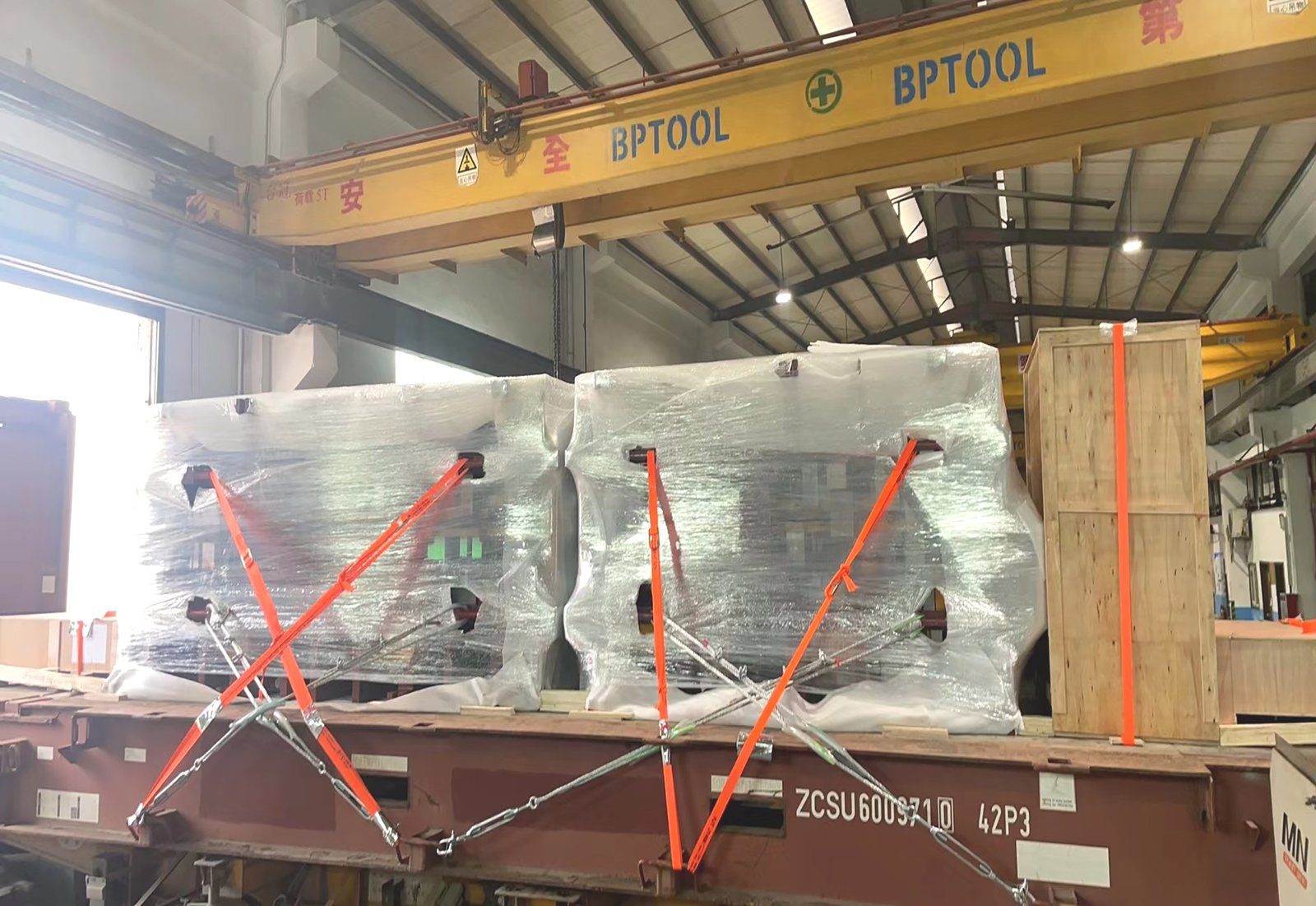 Close-up of cargo securing details for heavy machinery shipping