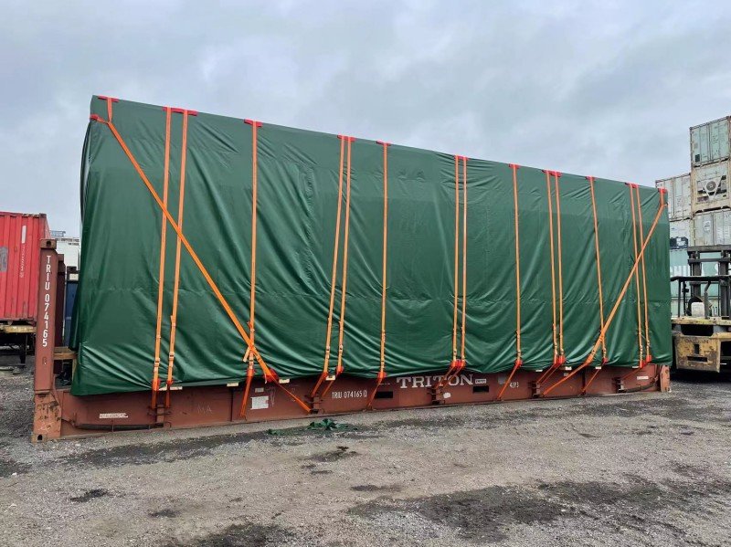 Massive steel structures being loaded directly onto a breakbulk vessel, bypassing container limitations for truly outsized project cargo.