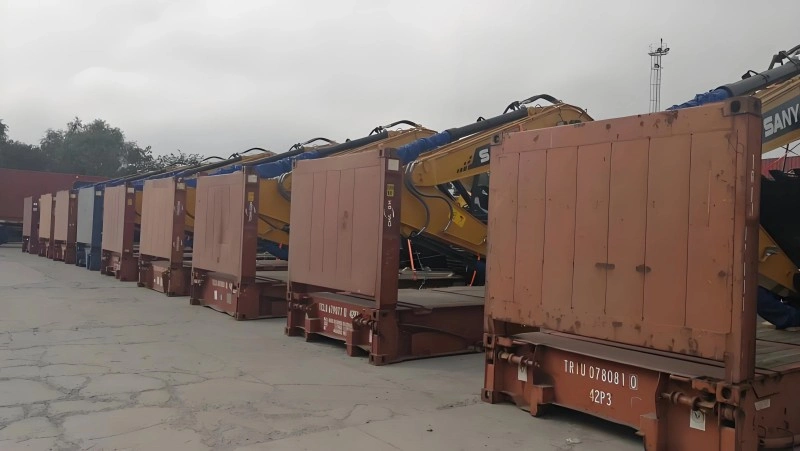 Step-by-step process of securing a heavy excavator on a flat rack container with chains and wooden blocking for safe overseas shipping.
