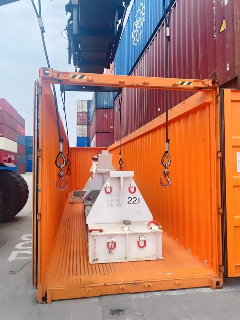 Oversized industrial equipment loaded on a Flat Rack container, showing the height and width of the cargo exceeding standard limits, requiring specialized handling and route planning.
