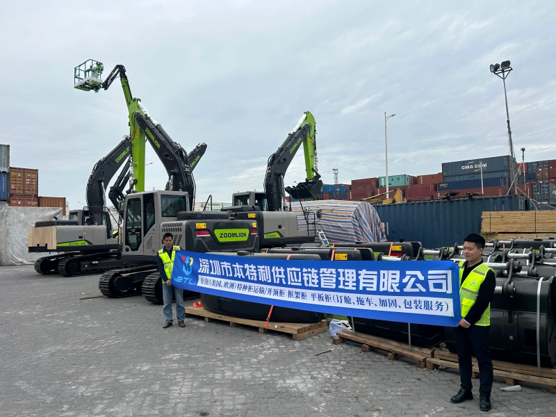 Two logistics professionals holding a banner for "Shenzhen BenteLi Supply Chain Management Co., Ltd." in front of several Zoomlion crawler excavators and heavy machinery parts at a container terminal.