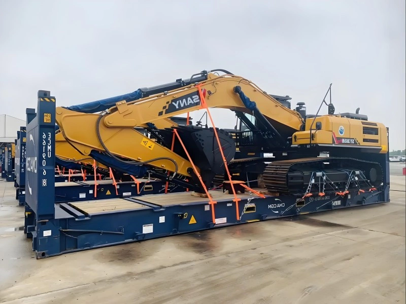 SANY excavator fully secured with cross-straps and blocking on an MBC AMC flat rack container, demonstrating multi-unit OOG load planning