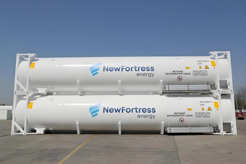 Two stacked white 45-foot LNG tank containers branded with NewFortress Energy logo, labeled "METHANE REFRIGERATED LIQUID", manufactured by CIMC Enric for Caribbean gasification projects