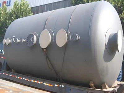 Industrial tank with multiple access ports and flanges loaded on flatbed trailer, ready for protective packing and OOG shipping