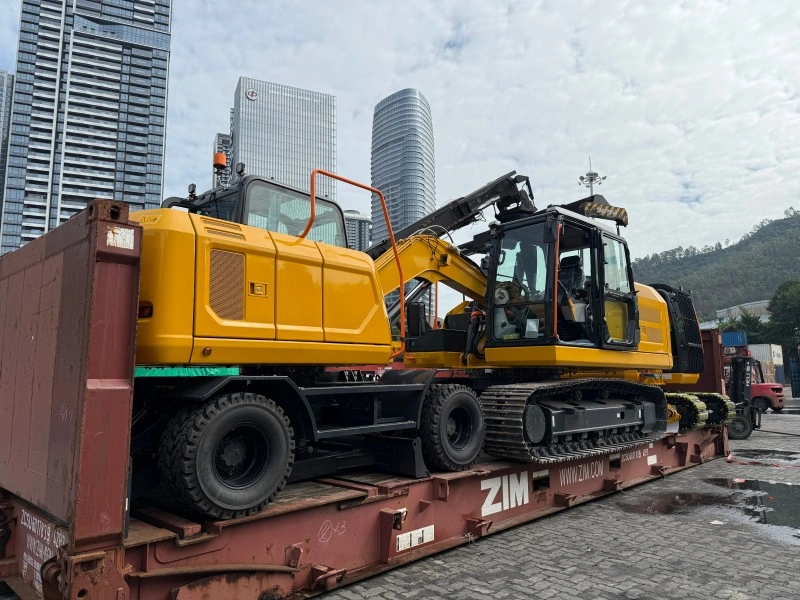 Yellow excavators being loaded onto a ZIM flat rack container under supervision, demonstrating secure handling and chain of custody for high-value OOG cargo at the port.