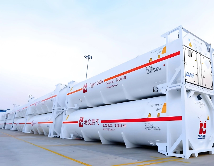 Stacked white ISO tank containers in blue support frames branded Tiger Gas and Lao Hu Gas with orange hazard bands and UN hazard labels for LNG shipment