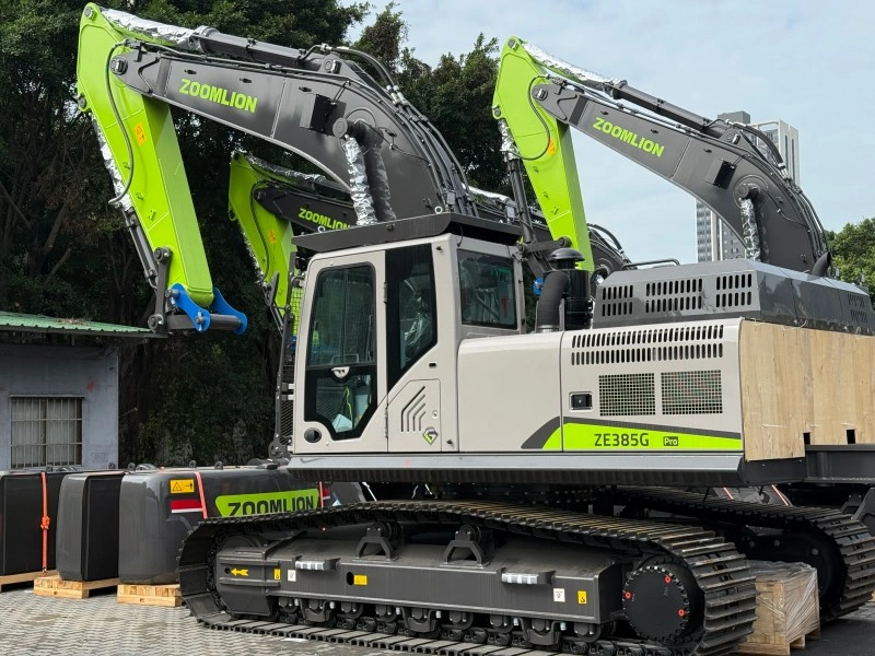 A close-up view of a new Zoomlion ZE385G Pro crawler excavator with a distinctive green and grey design, showcasing its robust track system and hydraulic arm.