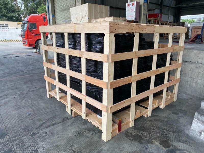 Multiple identical wooden crates lined up outdoors, showcasing scalable manufacturing and consistent quality control for bulk shipments