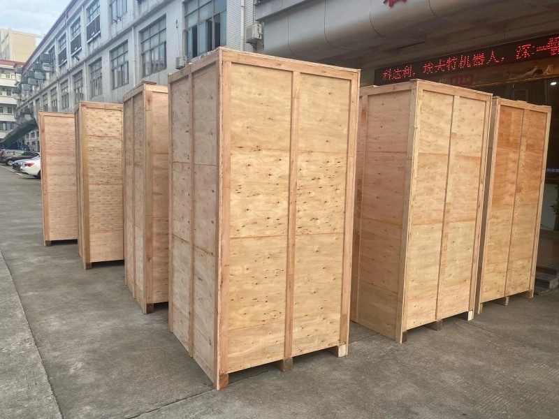 Row of uniform plywood export crates lined up outdoors, showcasing scalable manufacturing and consistent quality control for bulk shipments