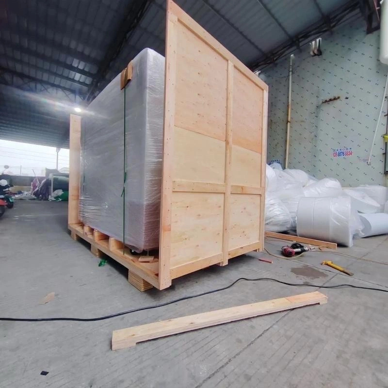 Large industrial wooden crates with reinforced bracing designed for secure machinery transport and ISPM 15 compliance
