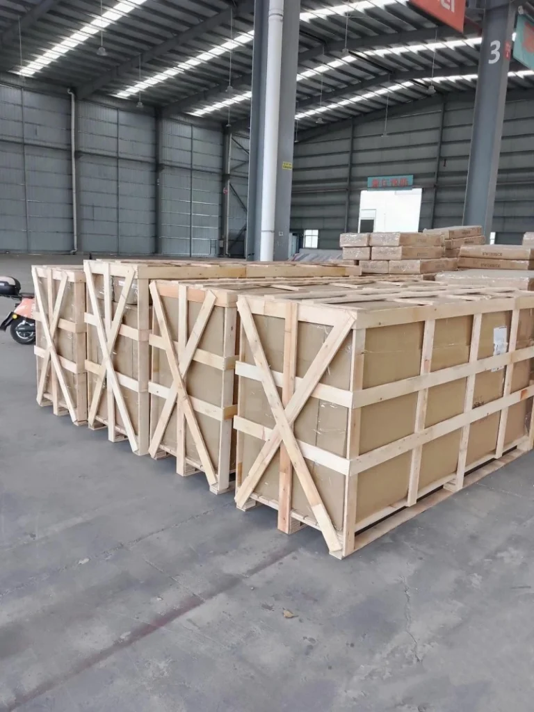 Large industrial wooden crates with reinforced bracing designed for secure machinery transport and ISPM 15 compliance