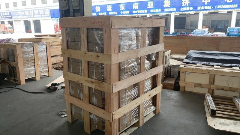 A tall, stacked wooden crate structure in a logistics center, illustrating efficient space utilization and robust load-bearing design for export freight.