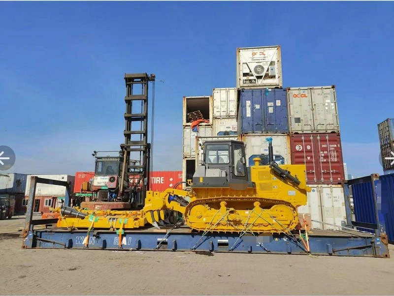 Profile view of a yellow crawler dozer strapped down on a flat rack container, demonstrating proper cargo securing and weight distribution strategies for industrial relocation.