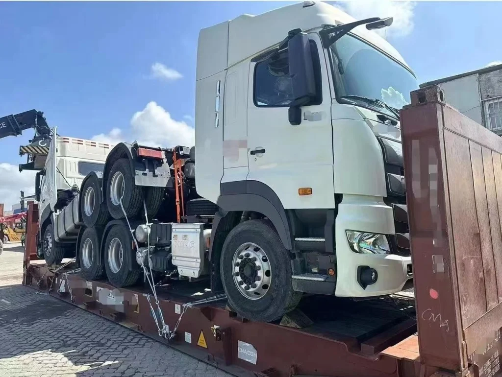 Close-up view of a truck cabin secured on a logistics platform, highlighting the importance of accurate dimension surveys and route planning to prevent costly delays.