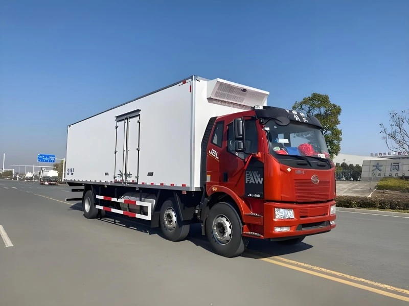 Refrigerated truck transporting temperature-sensitive cargo with controlled cooling systems for cold chain logistics